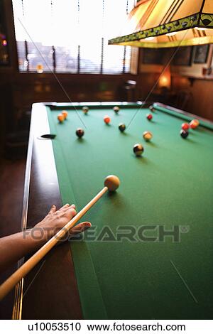 Woman's hand preparing to hit pool ball while playing billiards. View Large Photo Image Stock Image - Woman's hand preparing to hit pool ball while playing billiards.. Fotosearch