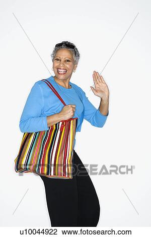 African American mature adult female holding big purse. View Large Photo Image Stock Image - African American mature adult female holding big purse.. Fotosearch