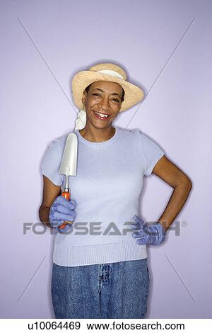 African American mature adult female with hand shovel. View Large Photo Image Stock Photo - African American mature adult female with hand shovel.. Fotosearch
