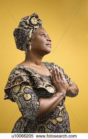 Stock Photography - African American mature adult female dressed in African costume.. Fotosearch