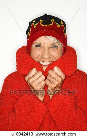 Caucasian mature adult female in coat and flame hat. View Large Photo Image Stock Image - Caucasian mature adult female in coat and flame hat.. Fotosearch