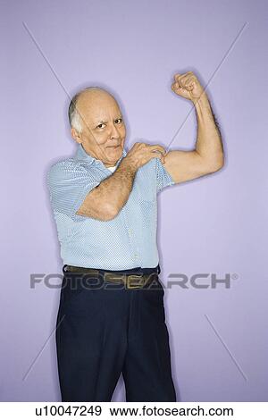 Caucasian mature adult male flexing muscles. View Large Photo Image Stock Photo - Caucasian mature adult male flexing muscles.. Fotosearch