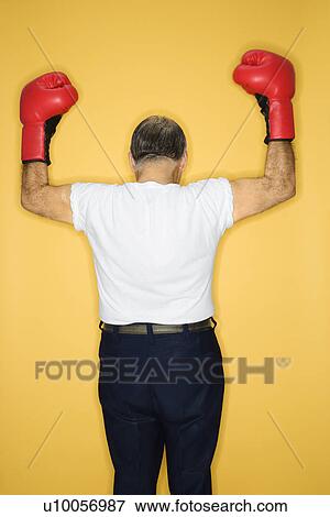 Caucasian mature adult male wearing boxing gloves. View Large Photo Image Stock Photo - Caucasian mature adult male wearing boxing gloves.. Fotosearch
