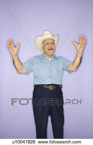 Stock Photograph - Caucasian mature adult male wearing cowboy hat.. Fotosearch