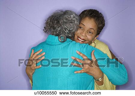 Mature adult African American females embracing. View Large Photo Image Stock Image - Mature adult African American females embracing.. Fotosearch