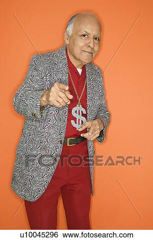 Mature adult Caucasian male wearing money sign necklace and pointing. View Large Photo Image Stock Photograph - Mature adult Caucasian male wearing money sign necklace and pointing.. Fotosearch