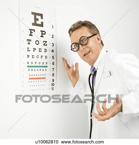 Mid-adult Caucasian male doctor wearing eyeglasses making gesture with eye chart in background. View Large Photo Image Stock Image - Mid-adult Caucasian male doctor wearing eyeglasses making gesture with eye chart in background.. Fotosearch