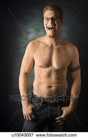 Portrait of shirtless adult Caucasian man on studio background laughing. View Large Photo Image Stock Photo - Portrait of shirtless adult Caucasian man on studio background laughing.. Fotosearch