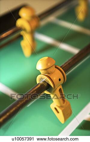 Stock Image - Player figurine on fooseball table.. Fotosearch