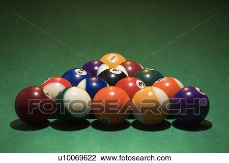 Rack of pool balls on green billiards table. View Large Photo Image Stock Image - Rack of pool balls on green billiards table.. Fotosearch