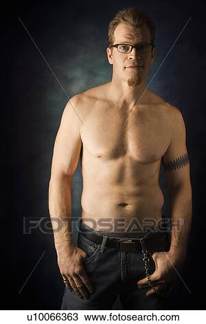Portrait of shirtless adult Caucasian man on studio background looking at viewer. View Large Photo Image Stock Image - Portrait of shirtless adult Caucasian man on studio background looking at viewer.. Fotosearch