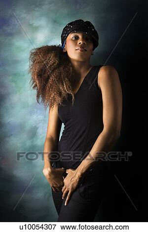 Studio portrait of hip African-American young adult woman looking at viewer. View Large Photo Image Stock Photo - Studio portrait of hip African-American young adult woman looking at viewer.. Fotosearch