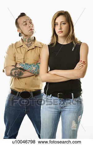 Caucasian mid-adult man looking at teen female who is looking away. View Large Photo Image Stock Photo - Caucasian mid-adult man looking at teen female who is looking away.. Fotosearch