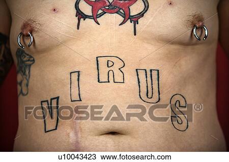 Stock Image - Caucasian mid-adult man midriff with tattoos and piercings.. Fotosearch