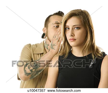 Caucasian mid-adult man whispering into ear of teen female. View Large Photo Image Stock Photo - Caucasian mid-adult man whispering into ear of teen female.. Fotosearch