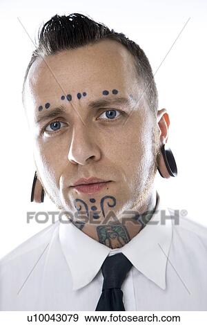 Caucasian mid-adult man with tattoos and piercings wearing necktie. View Large Photo Image Stock Photo - Caucasian mid-adult man with tattoos and piercings wearing necktie.. Fotosearch
