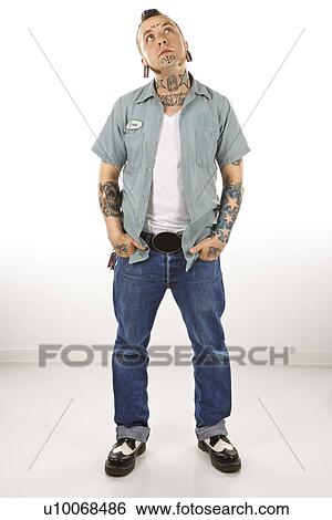 Caucasian mid-adult man with tattoos and piercings. View Large Photo Image Stock Photograph - Caucasian mid-adult man with tattoos and piercings.. Fotosearch