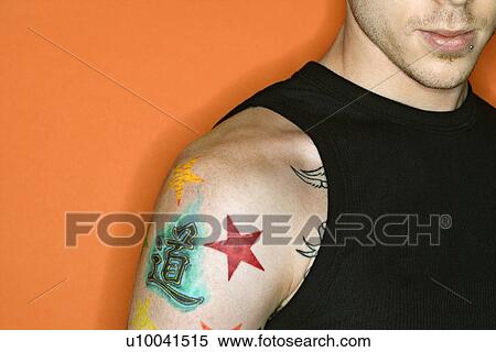 Young adult Caucasian male with tattoos. View Large Photo Image Stock Photography - Young adult Caucasian male with tattoos.. Fotosearch