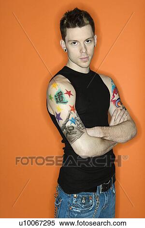 Young adult Caucasian male with tattoos. View Large Photo Image Stock Photography - Young adult Caucasian male with tattoos.. Fotosearch