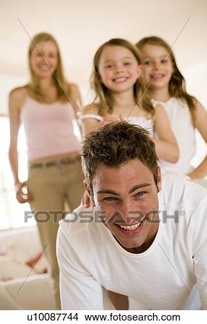 Picture - Family at home. Fotosearch