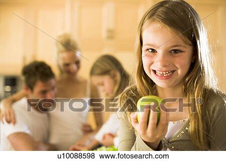 Stock Photo - Family at home. Fotosearch
