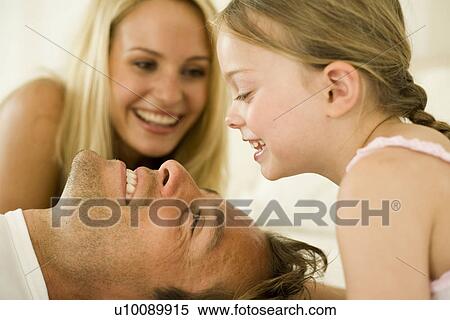 Stock Photography - Family at home. Fotosearch