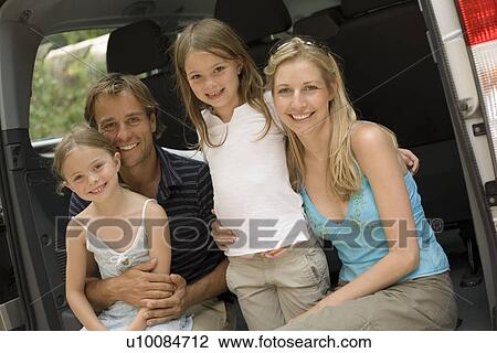 Family getting into car View Large Photo Image Stock Image - Family getting into car. Fotosearch