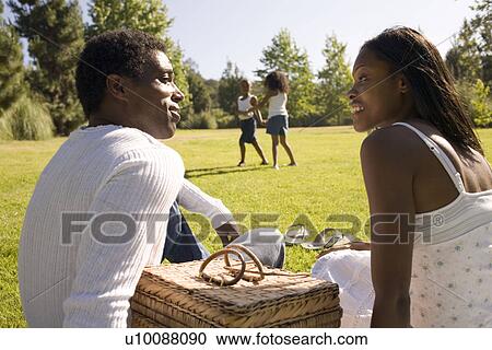 Stock Image - Family in park. Fotosearch