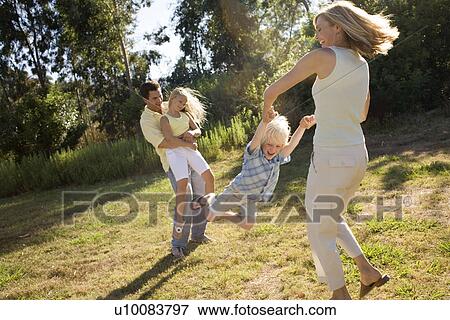 Stock Photo - Family in park. Fotosearch
