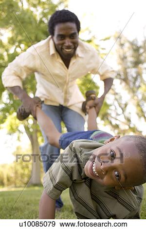 Stock Photo - Father and son in park. Fotosearch