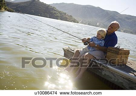 Picture - Grandfather and grandson fishing. Fotosearch