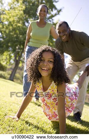 Grandparents and granddaughter in park View Large Photo Image Stock Image - Grandparents and granddaughter in park. Fotosearch