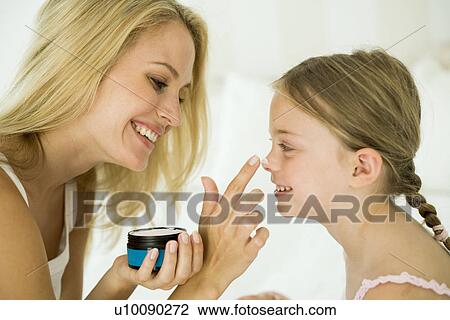 Mother and daughter with makeup View Large Photo Image Stock Image - Mother and daughter with makeup. Fotosearch