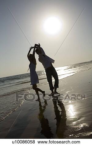 Stock Photo - Couple on beach. Fotosearch