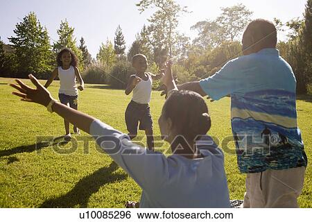 Family and grandparents in park View Large Photo Image Stock Photograph - Family and grandparents in park. Fotosearch