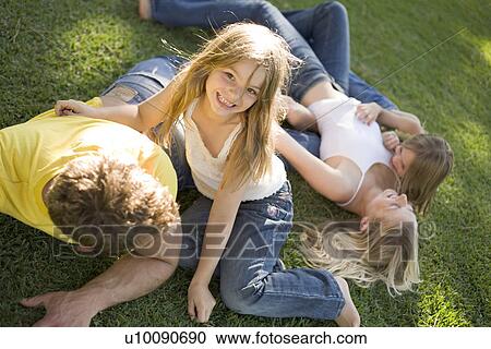 Stock Image - Family in park. Fotosearch