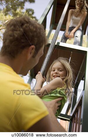 Stock Photo - Father and daughter in park. Fotosearch