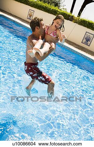 Father and daughter in pool View Large Photo Image Picture - Father and daughter in pool. Fotosearch