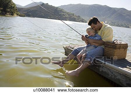 Stock Image - Father and son fishing. Fotosearch