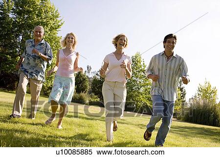 Grandparents and family in park View Large Photo Image Stock Photography - Grandparents and family in park. Fotosearch