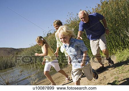 Grandparents and grandchildren by lake View Large Photo Image Stock Photo - Grandparents and grandchildren by lake. Fotosearch