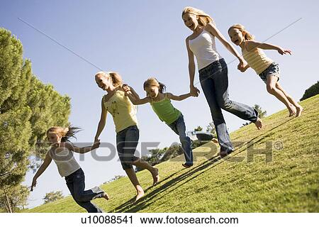 Stock Image - Mothers and daughters in Park. Fotosearch