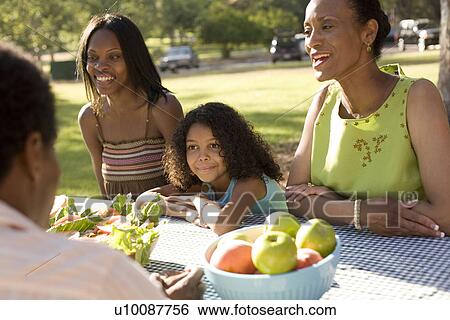 Stock Photograph - Family and grandparents in park. Fotosearch