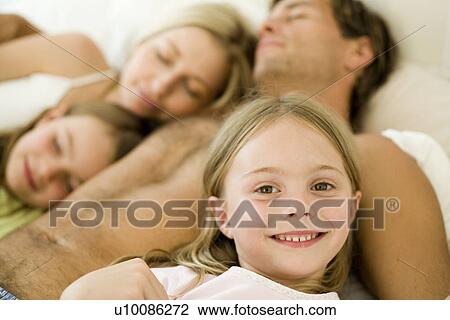 Stock Image - Family at home resting. Fotosearch