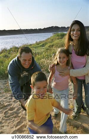Family in park running by lake View Large Photo Image Stock Image - Family in park running by lake. Fotosearch