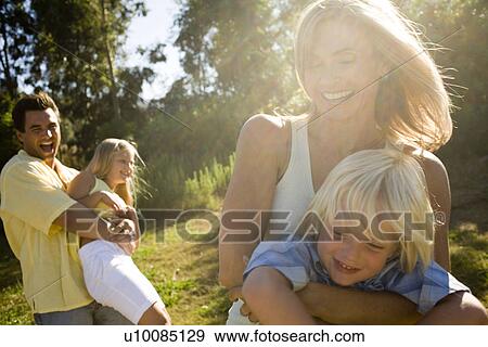 Stock Photo - Family in park. Fotosearch