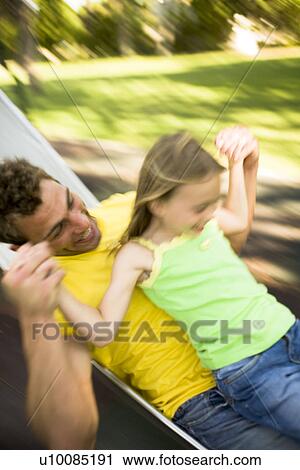 Father and daughter on slide View Large Photo Image Stock Image - Father and daughter on slide. Fotosearch