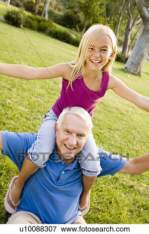 Stock Photo - Grandfather and granddaughter. Fotosearch