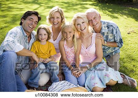 Stock Photo - Grandparents and family in park. Fotosearch