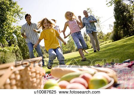 Grandparents and family in park View Large Photo Image Stock Photography - Grandparents and family in park. Fotosearch